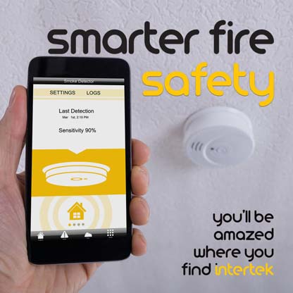 A smartphone app for managing a smoke detector shown in the background