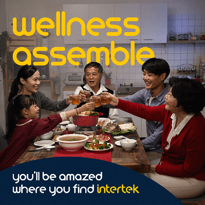 An Asian family making a toast at the dinner table